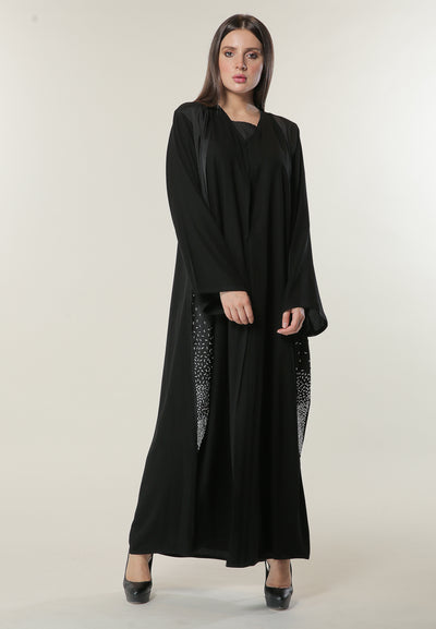 Shop Black Abaya with Handwork on Twin Panels is a sophisticated outerwear choice. Update your wardrobe with this glamourous abaya. Stitched with extra smooth fabric. Luxurious designer Abaya. Available in all sizes. Order designer abaya online now. (6701408944312)